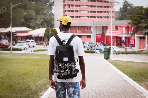 Preview: A male walking with cap on head