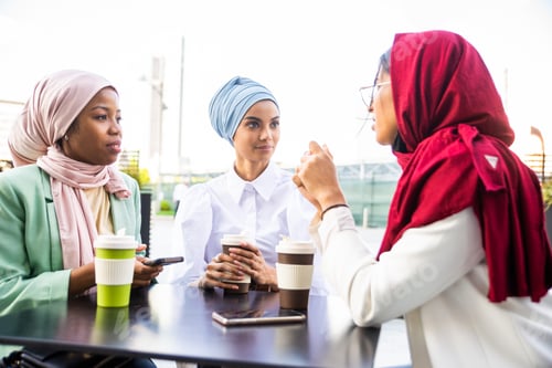 Preview: Beautiful muslim girl wearing hijab bonding outdoors