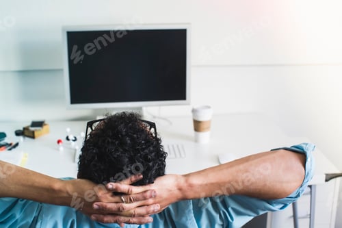 Preview: Young man taking break at office