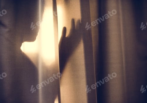 Preview: Human shadow behind a curtain