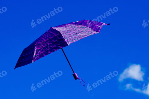 Preview: Purple umbrella falling from the sky