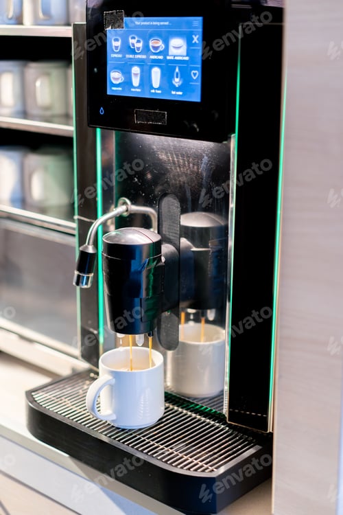 Preview: close-up of the process of making fragrant coffee with an automatic coffee machine in a hotel