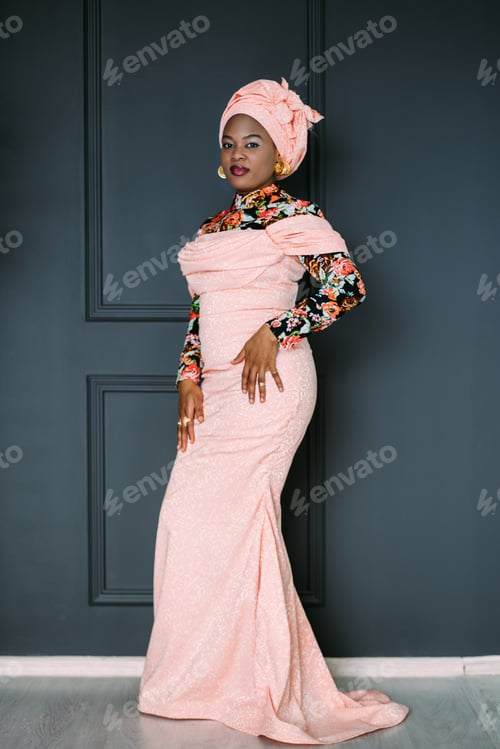 Preview: Full length shot of elegant charming African woman wearing bright colorful fashionable dress with