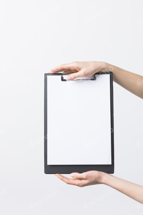 Preview: partial view of woman holding blank clipboard in hands isolated on white