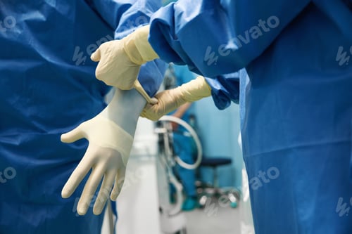 Preview: Doctor is put on sterile gloves before the surgical operation