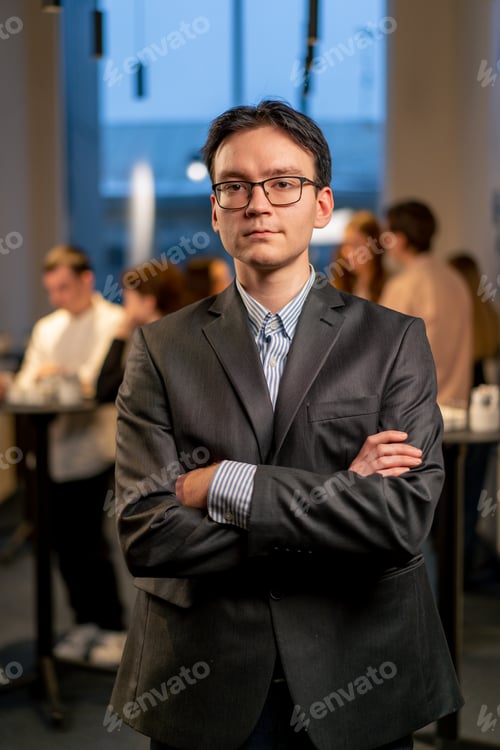 Preview: owner of the company in glasses at a business conference during a coffee break work networking