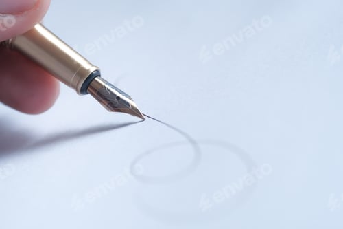 Preview: Closeup view of a Fountain Pen skillfully Creating Elegant Calligraphy on a White Sheet of Paper