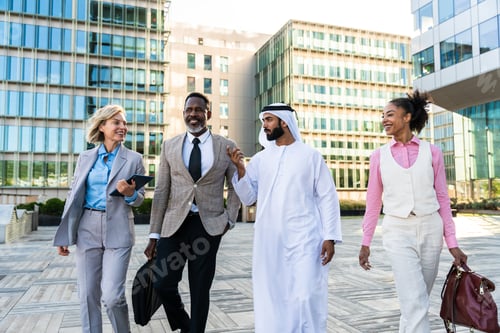Preview: Group of multiethnic business people meeting an emirati businessman