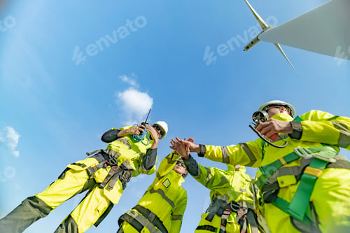 Preview: Team of engineers a wind turbine power generation site.