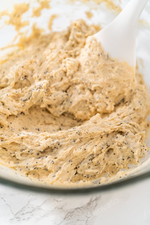 Preview: Lemon poppy seed muffins garnished with almond slivers