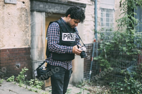 Preview: Photographer checking previews on camera