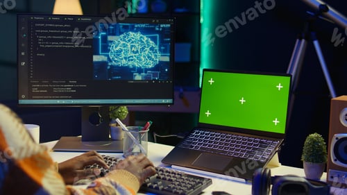 Preview: African american web developer using isolated mockup on pc and writing code