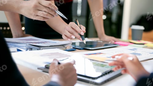 Preview: Business people hands pointing and using a tablet during a strategy meeting in office