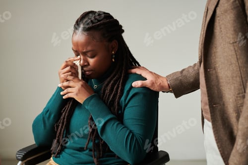 Preview: Crying girl talking to psychologist