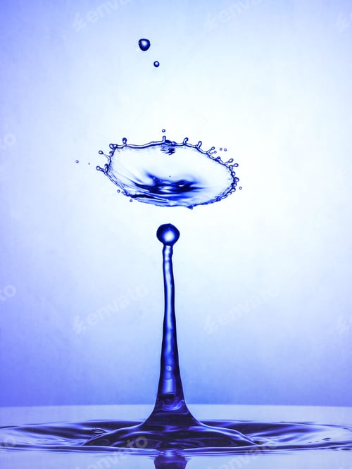 Preview: Abstract closeup of a single water droplet falling and making a splash.