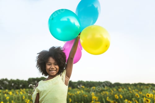 Preview: Pretty afro american girl in a sunflowers field