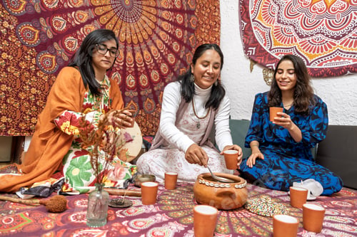 Preview: Women enjoying organic cocoa ceremony for alternative medicine and healthy living