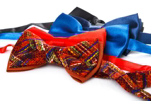 Preview: Colorful Bow Ties on a White Surface