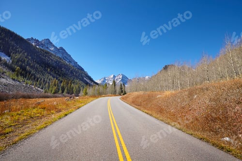Preview: Scenic mountain road, Maroon Bells in distance.