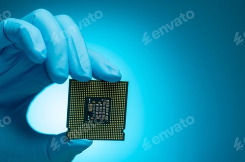 Preview: Electronic engineer hand holding computer chip on blue background. Chipset of electronic circuit boa