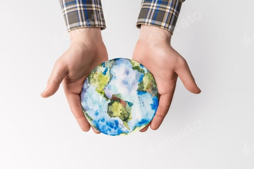 Preview: partial view of man holding handmade globe in hands isolated on grey, environment protection concept