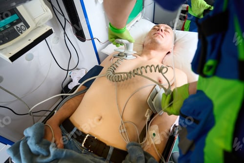 Preview: Ambulance crew uses a defibrillator to resuscitate a patient