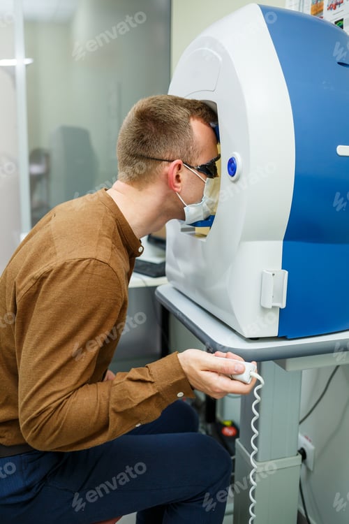 Preview: Professional medical equipment scanning the patient's eyes. The device of a modern healthcare clinic