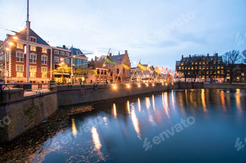 Preview: Twilight over a serene European canal with historical buildings