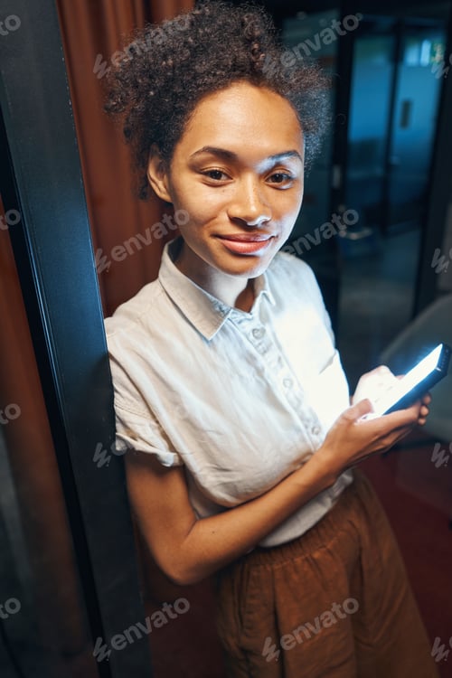 Preview: Employee searching information in smartphone for conference