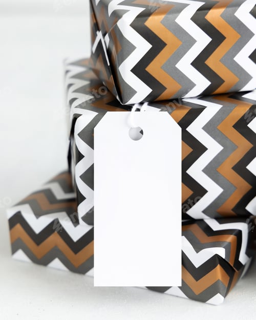 Preview: Presents Wrapped in chevron paper with blank gift tag close up, label Mockup