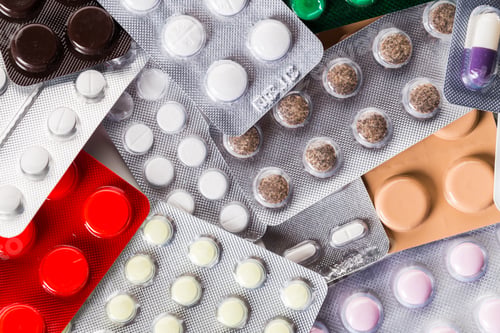 Preview: A pile of pills in blister packs close up