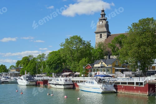 Preview: Old center of the town in Europe: Lutheran church, old wooden houses, yachts.