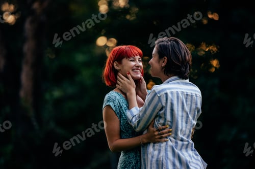 Preview: Two lesbian girls, looking at each other, going for a kiss, being outdoor.