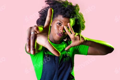 Preview: Young black woman dancing indoor smiling positive gesturing