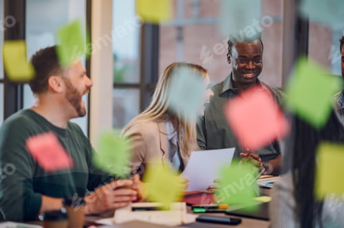 Preview: Multiracial business team working together and having a meeting in the office