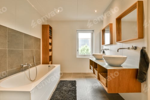 Preview: a bathroom with a bath tub and two sinks