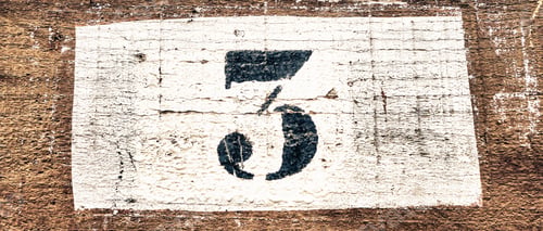 Preview: Closeup shot of number the 3 on a wooden background