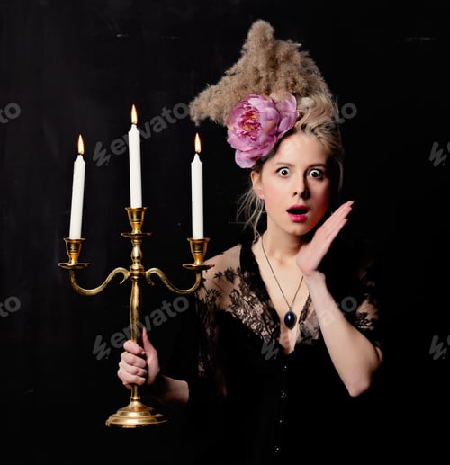 Preview: Beautiful blonde countess with a candlestick