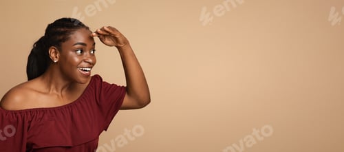 Preview: Curious african american young woman looking at something