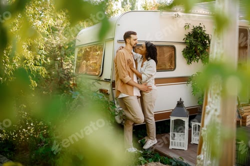 Preview: Love couple embraces in rv, camping in a trailer