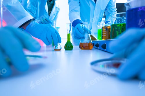 Preview: Scientists conducting chemical experiments in laboratory