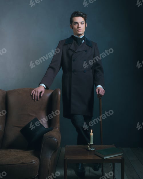 Preview: Retro Dickens Style Man Standing With Cane Next To Leather Chair.