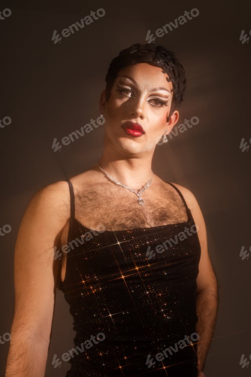 Preview: Beautiful Latin Drag Queen in Studio Portrait With Mist and Star Reflections Capturing Queer Essence