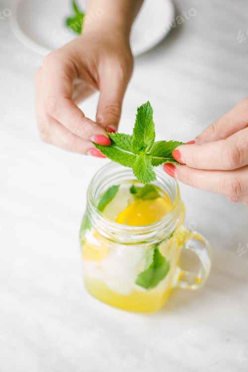 Preview: Mint Lemonade Refreshment Being Prepared in Kitchen