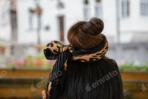 Preview: Closeup shot of bun hair. Hair in a bun tied with a bandana.