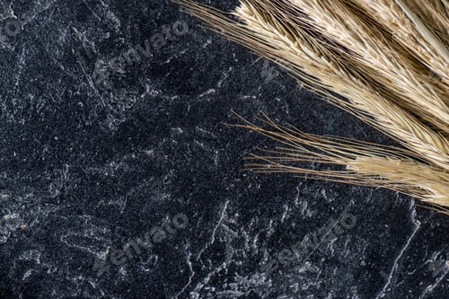Preview: close up view of wheat on dark marble tabletop