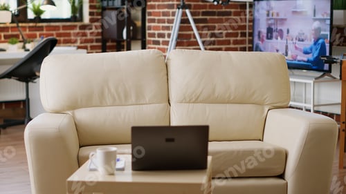 Preview: Empty brick wall house with nobody in it and with modern portable computer on desk