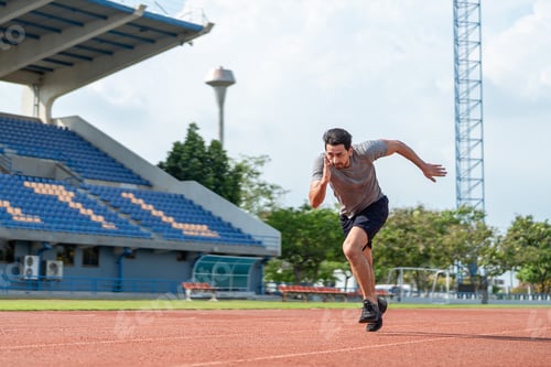 Preview: Caucasian young man athlete running exercise on a track at the stadium.