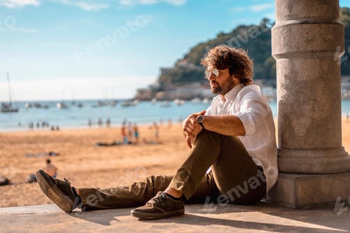 Preview: Summer lifestyle with a young dark-haired Caucasian man with long beard,