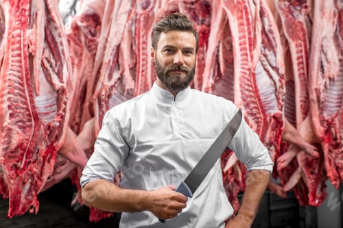 Preview: Portrait of a butcher at the meat manufacturing